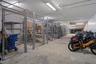 Enclosed Community Storage Area features secure cages for a fee (waiting list) as well as open bike and board storage.