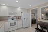 Eat-in Kitchen features a small table as well as a pass through to dining area