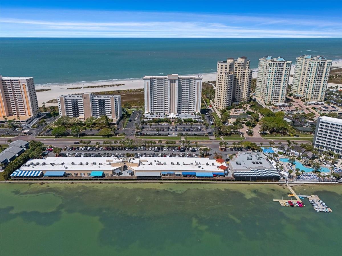 Aerial view of Shopping Center with restaurants (Columbia, Backwaters etc) with waterfront dining that is just across the street from the community!  