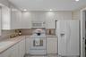 A roomy & bright kitchen with plenty of storage!