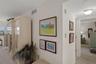 Hallway to bedrooms & bathrooms is adjacent to dining area
