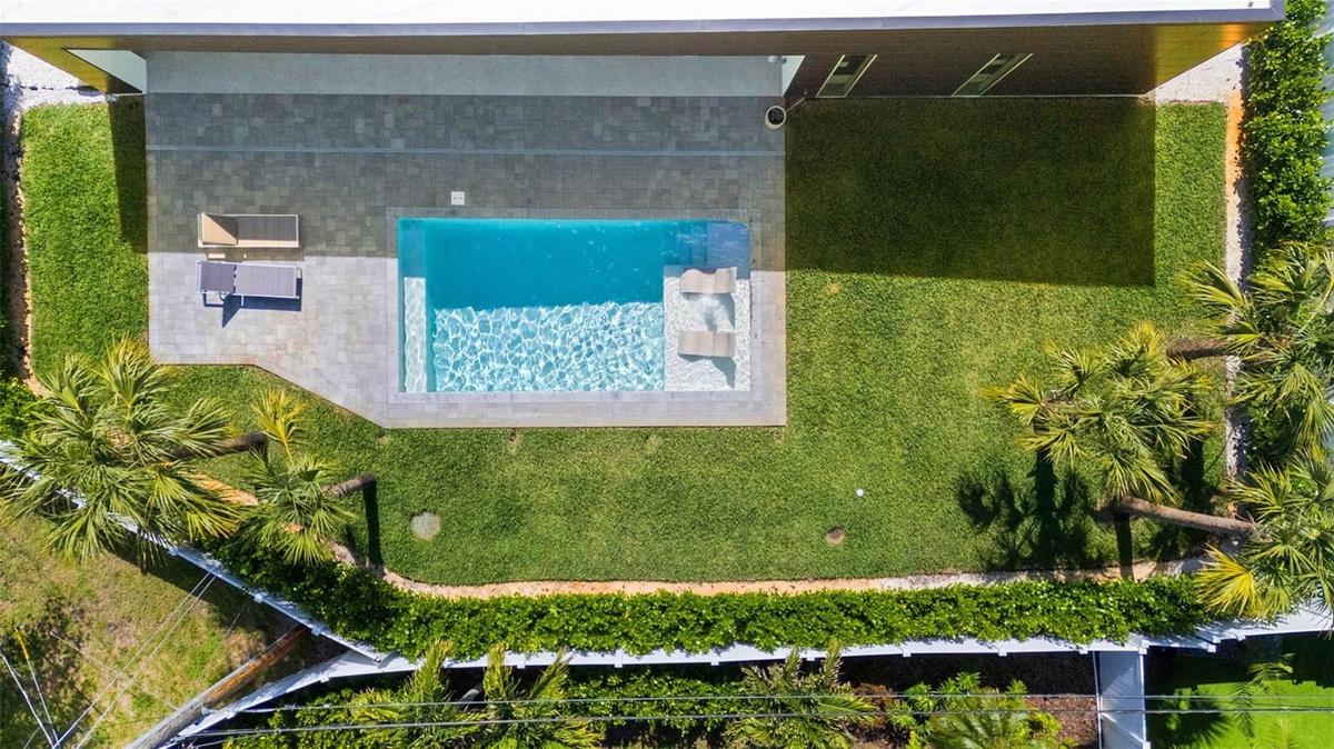 Pool With Sun Shelf And Plenty Of Green Space In Your Fully Enclosed Private Oasis