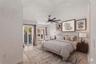 Virtually stage primary suite with en-suite bath and sitting area.