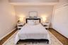 Light filled bedroom with generous storage and easy access to a full bath.