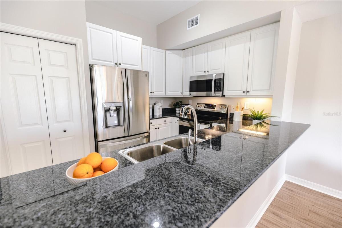 Bright, functional kitchen with open flow for entertaining.