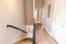 Beautiful hallway with clean lines creates a seamless flow to full bathroom and bedroom.