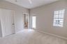 Third floor guest suite with spacious closets and a serene ensuite bath.