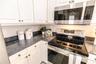 Bright, functional kitchen with open flow for entertaining.