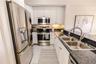 Bright, functional kitchen with open flow for entertaining.