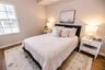 Light filled bedroom with generous storage and easy access to a full bath.