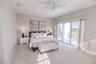 Spacious primary suite with elevated water views and private balcony.
