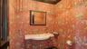 Designer powder room with gold-leaf ceiling