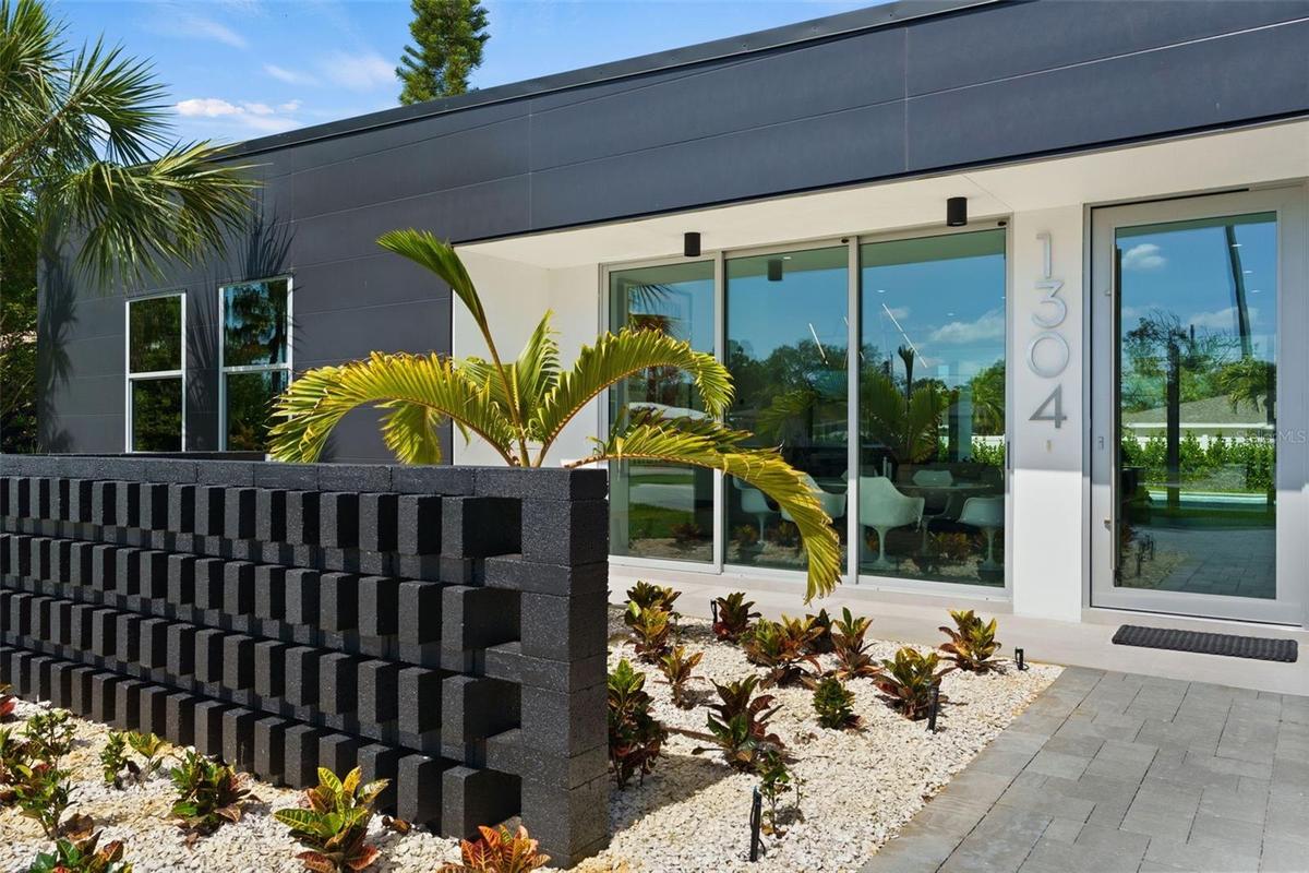 Breeze Block Creates A Courtyard Entry On This Stunning Home!