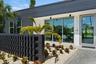 Breeze Block Creates A Courtyard Entry On This Stunning Home!