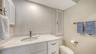 Guest bathroom.  A mirror has now been placed above the sink.