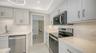 Granite counters. The view leading into the dining room.