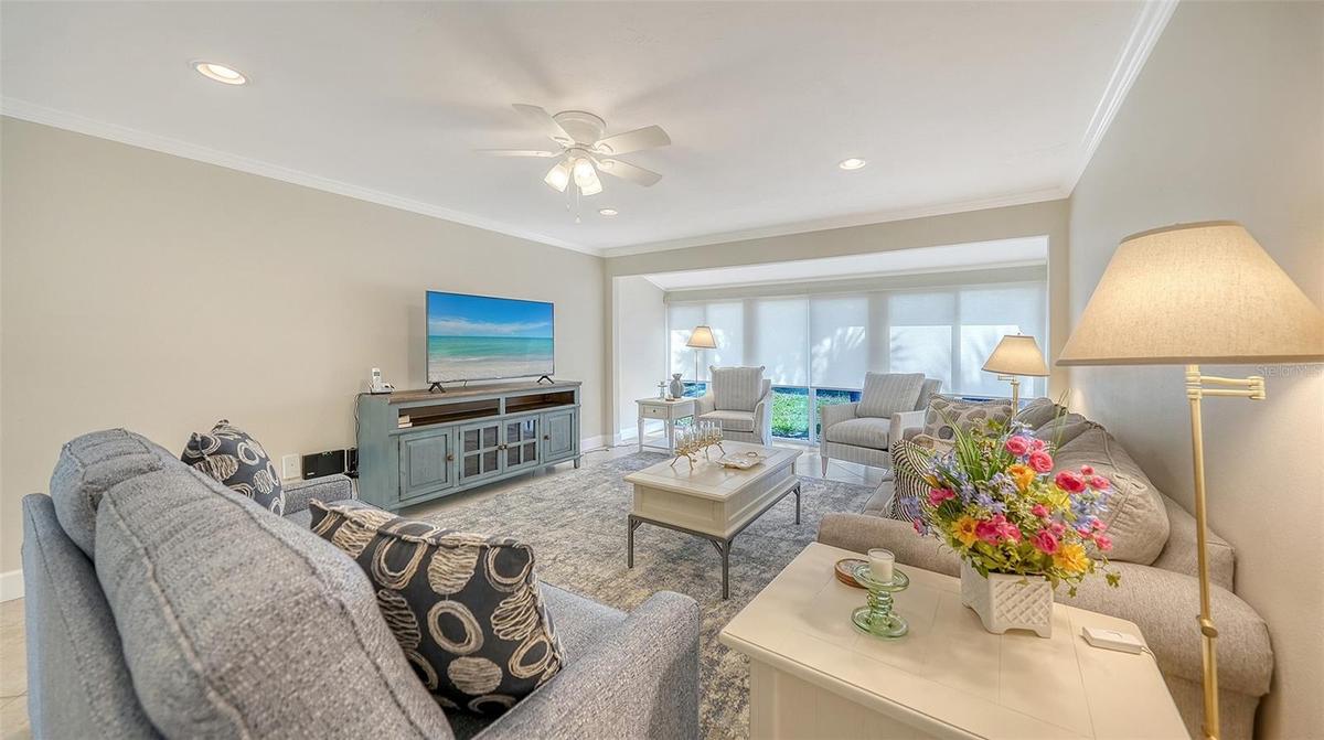 Surprisingly large living space with neutral paint, soft recessed lighting, and new gleaming baseboards.