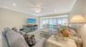 Surprisingly large living space with neutral paint, soft recessed lighting, and new gleaming baseboards.