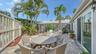 Sunny open air patio provides plenty of space for entertaining and al fresco dining.