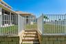 Access gate from elevated back yard to dock and adjacent common