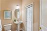 Powder Bath off of lanai and just outside of Primary Bedroom for easy access