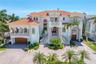 Striking front elevation of this exceptional Tierra Verde luxury residence.