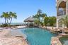 Lagoon style pool with spa and waterfall.