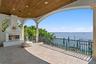This gorgeous balcony off the family room, with an outdoor fireplace provides the perfect setting for morning coffee or evening cocktails.