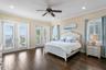 Main level primary suite with sweeping ocean views.