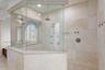 Top level primary ensuite with soaking tub and walk-in shower.