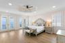 Top level primary suite with spacious balcony overlooking the sparkling waters of Tampa Bay.