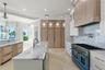 Beautiful Tampa Bay views can be enjoyed from every angle of this elegant kitchen.