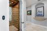 The residence is equipped with a private elevator for effortless access to all floors.