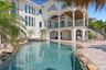 Serene lagoon pool and spa with a waterfall