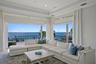 Enjoy stunning waterfront views of Tampa Bay from the family room as the sliding glass doors open completely to the outdoors.