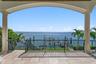 View from the balcony off of the family room, overlooking the dock and sparkling water.