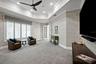A sophisticated social lounge complete with a built in bar and media area.