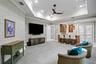 Elegant social lounge featuring a refinded bar.