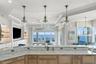 Another breathtaking kitchen view overlooking the stunning waterfront landscape.
