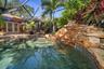SALT WATER POOL WITH SUNSHELF AND WATERFALL