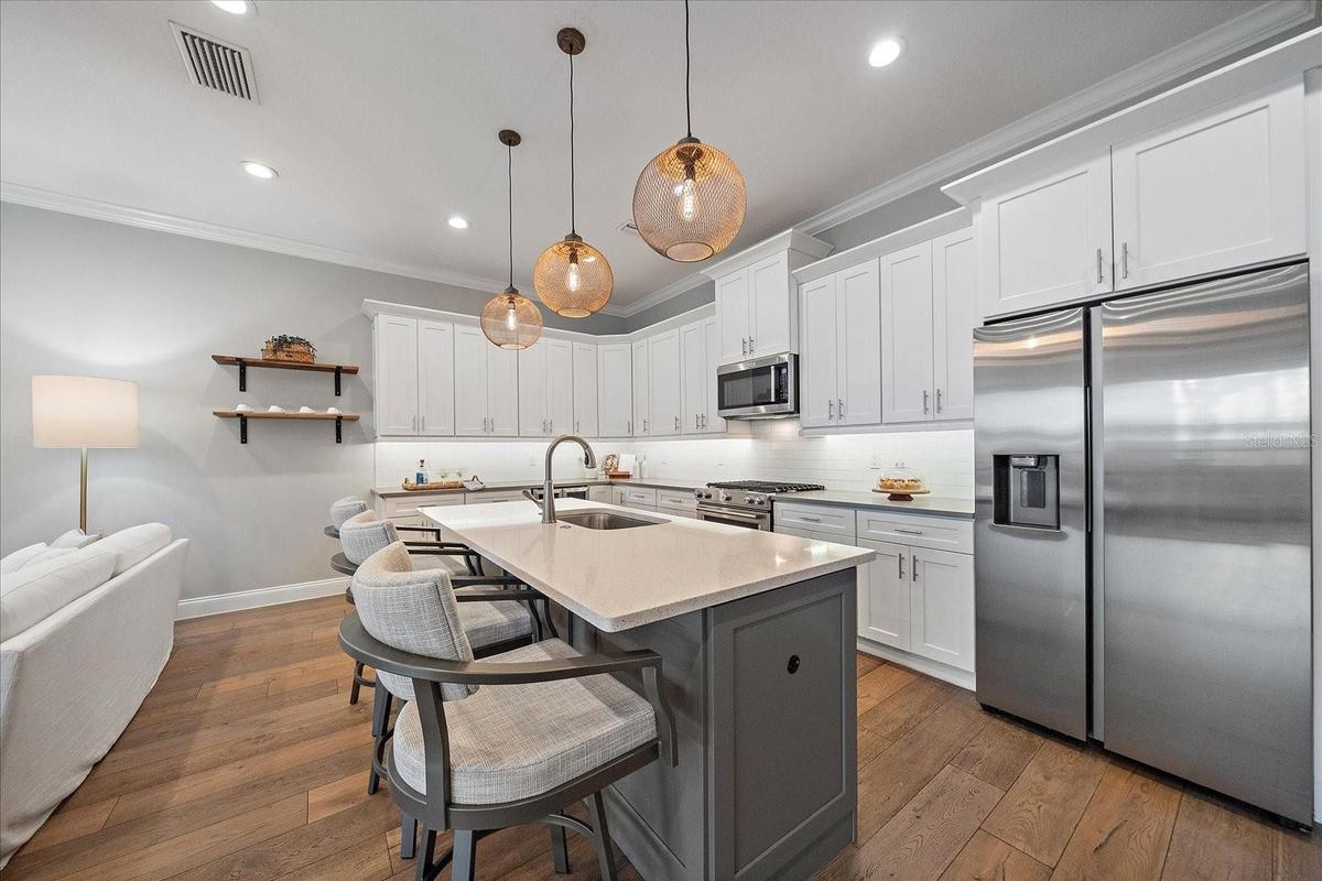 Kitchen with new stainless steel appliances, quartz countertops, wine fridge - 1st Floor