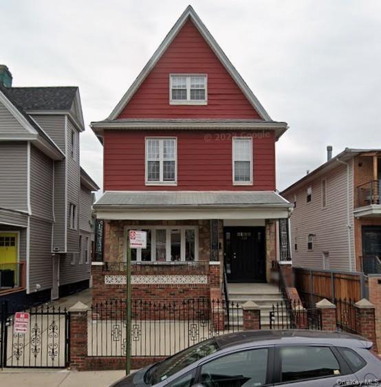 Red siding exterior with a prominent gable roofline