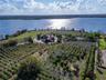 A rare opportunity to own one of Auburndale’s most impressive private estates. Set on 44.30 beautifully landscaped acres with more than 2,300 feet of 