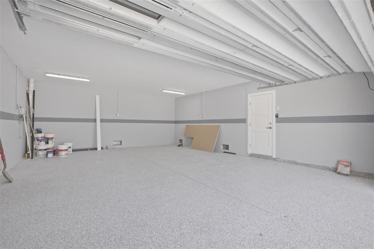 Oversized 2 car garage with epoxy flooring.