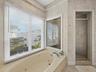 Primary Suite bath with soaking tub and walk in shower