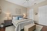Primary Bedroom with Walk-in Closet with custom shelving