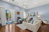 Living Room with a Balcony overlooking the community pool