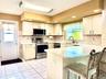 Large eat in kitchen next to formal dining room