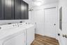 Inside Laundry Room w/ Wash sink & storage