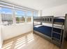 SECOND BEDROOM OCEANSIDE GLASS TERRACE EASTERN OCEAN VIEWS (HURRICANE IMPACT WINDOWS).
